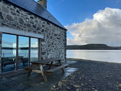 A secluded Skye boathouse where rugged beauty meets refined coastal living.