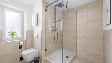 Deluxe Apartment, Courtyard View | Bathroom | Shower, hair dryer, towels, soap