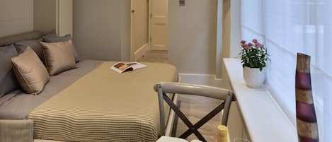 Iron/ironing board, travel crib, free WiFi, bed sheets