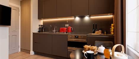 Fridge, microwave, stovetop, coffee/tea maker