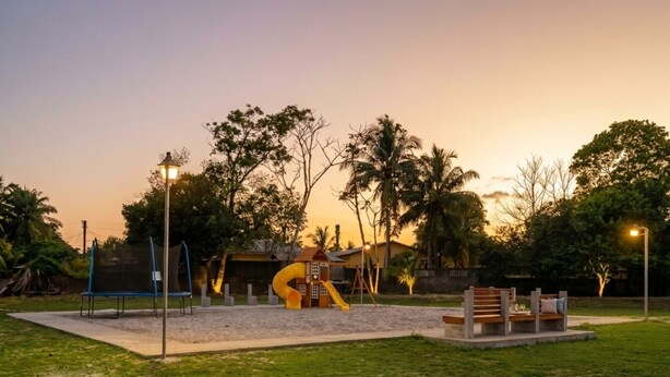 A playground with a slide and swings, surrounded by grass and trees. - Casa Efra | Entire Home in Tela | A/C | 3BR | Sleeps 8 | Near Beach (Tela)