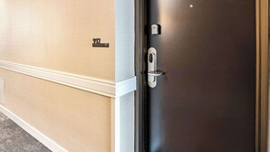 A door with a number plate, a door handle, and a keypad lock. - Mountain View 9th Floor City Views Free Pkg, Gym (Salt Lake City)