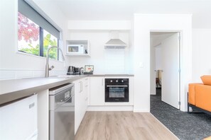 Departamento Deluxe, regadera para personas con discapacidad, para no fumadores | Cocina privada | Microondas, horno, parrilla de estufa y lavavajillas 