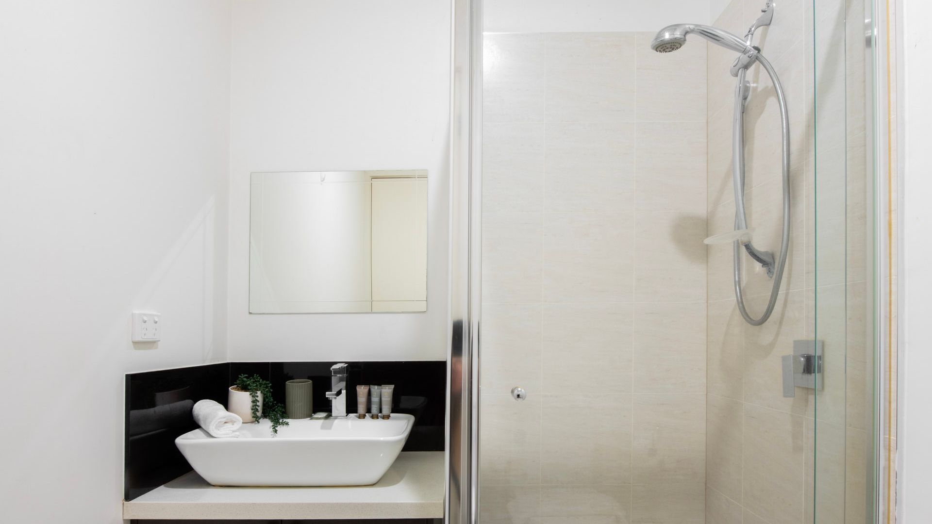 Shower, hair dryer, towels