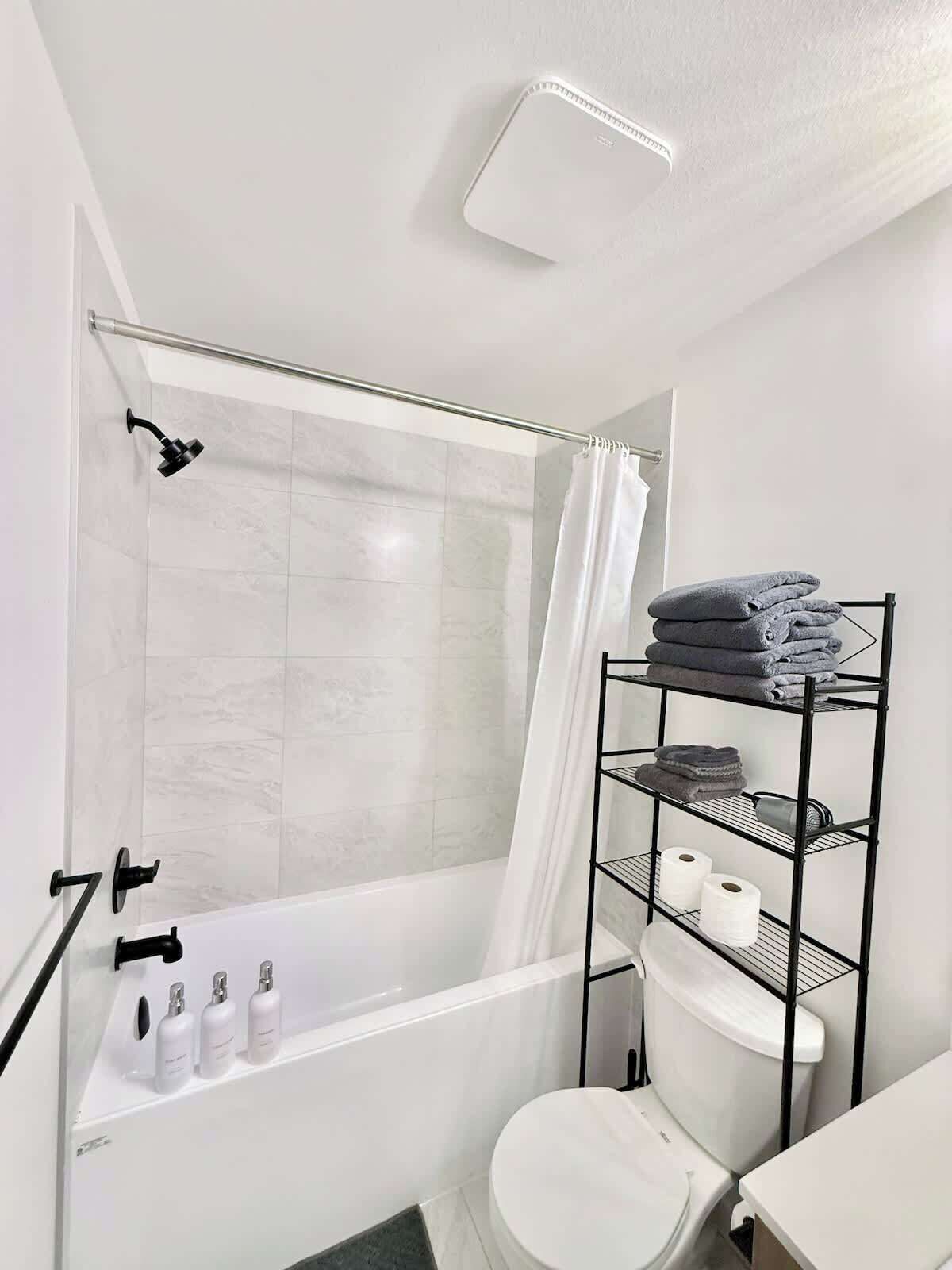 Shower, hair dryer, towels, shampoo