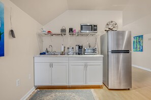 Fridge, microwave, coffee/tea maker, cookware/dishes/utensils