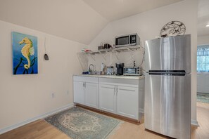 Fridge, microwave, coffee/tea maker, cookware/dishes/utensils