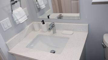 Hair dryer, towels, soap, toilet paper