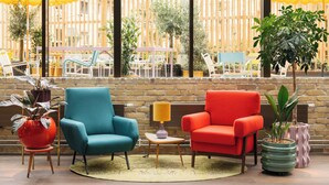 A room with two chairs, a small table, a lamp, and a potted plant. - Ruby Frida Hotel Stockholm By IHG (Stockholm)