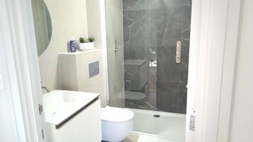 Shower, hair dryer, towels, soap