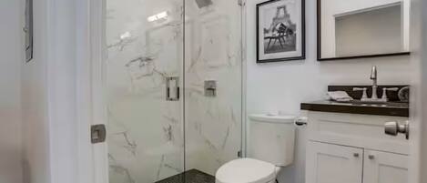 Shower, hair dryer, towels, soap