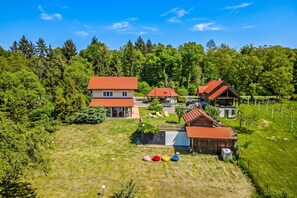 A residential area with multiple houses, a grassy yard, and a vineyard. - Family Retreat near Zagreb with Pool & Garden, Velika Buna, Croatia (Velika Buna)