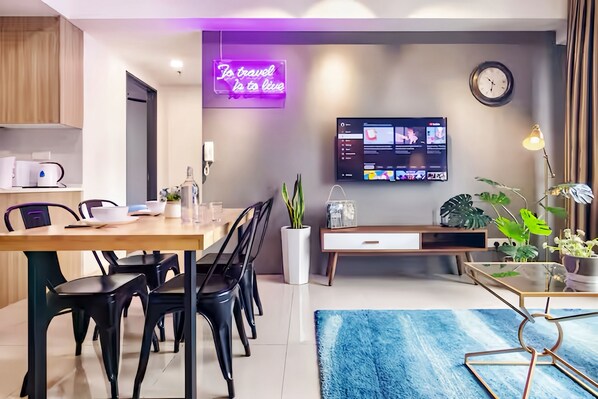 Superior Apartment | Living area | LED TV - Tropicana 218 Macalister by Local Host (George Town)