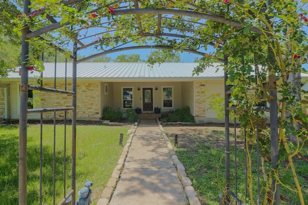 Private home with a rose arbor walkway. Quiet neighborhood, close to everything.