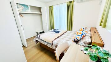 Desk, laptop workspace, blackout curtains, iron/ironing board