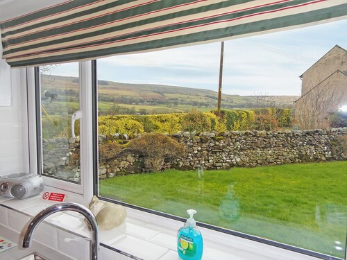 Single storey detached cottage with enclosed gardens and spectacular views.