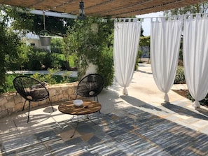 Deluxe Suite, Patio, Garden View | Terrace/patio