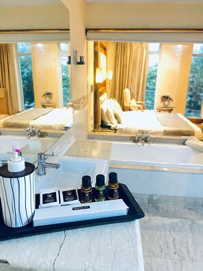In-room safe, desk, laptop workspace, blackout curtains - The Luxotic Suites (Gurugram)