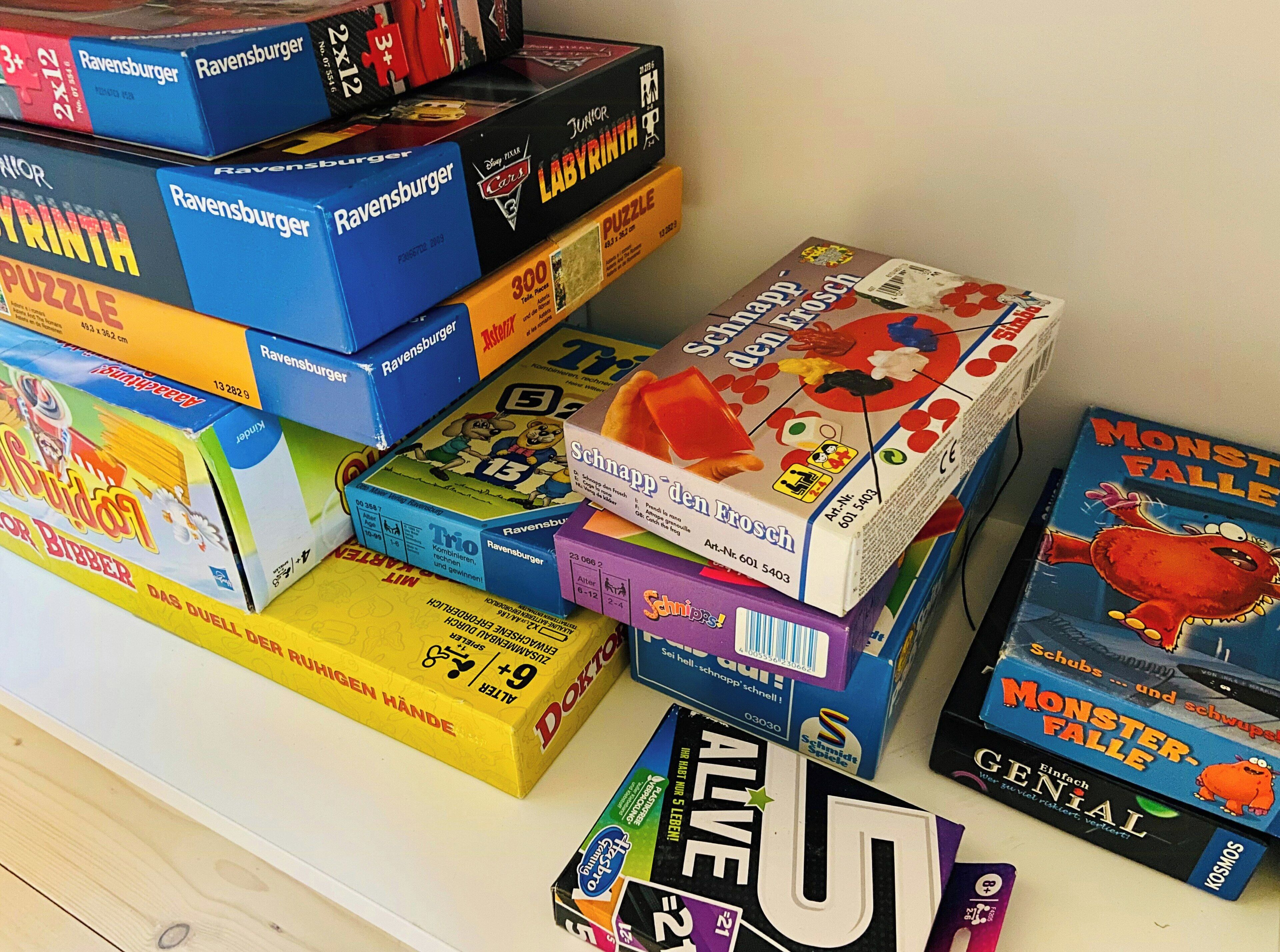 A collection of board games with various titles and age recommendations.