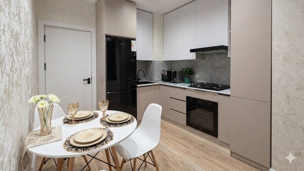 A modern kitchen with white cabinets, a black refrigerator, and a dining area with a white table set for four. - Modern Apartment in Alfraganus  Rent Car & Moto (Tashkent)