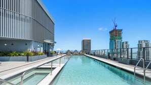 A rooftop pool with a view of the city skyline, including a building under construction. - Downtown Miami near Science&Art Museums (Miami)