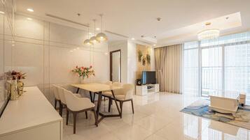 Family Apartment, 3 Bedrooms, Balcony | Living area | 42-inch flat-screen TV with digital channels
