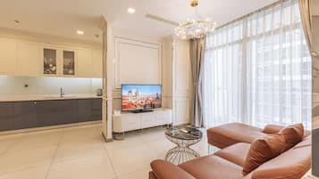 Family Apartment, 3 Bedrooms, Balcony | Living area | 42-inch flat-screen TV with digital channels