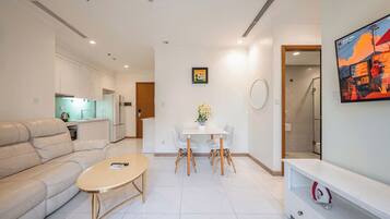 Deluxe Apartment, 1 Bedroom, Balcony | Living room | 42-inch flat-screen TV with digital channels