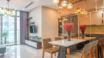 Deluxe Apartment, 2 Bedrooms, Balcony | Living area | 42-inch flat-screen TV with digital channels
