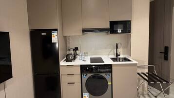 Fridge, microwave, cookware/dishes/utensils