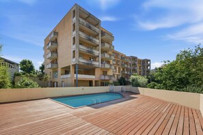 A multi-story residential building with a rooftop swimming pool. - Functional Holiday Base in Grasse (Grasse)