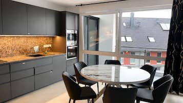 Penthouse, Balcony | Private kitchen | Full-size fridge, microwave, oven, stovetop