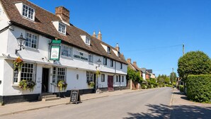 A traditional white building with a sign reading 'The Green Dragon' and a signboard outside. - The Boat Hole - Riverside Living in Cambridge (Cambridge)