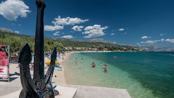 Beach nearby, white sand, beach towels