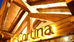 A wooden sign with the name 'le Cortina' illuminated, indicating a hotel or resort. - Alpine Apartment With Beautiful Views (Les Deux Alpes)