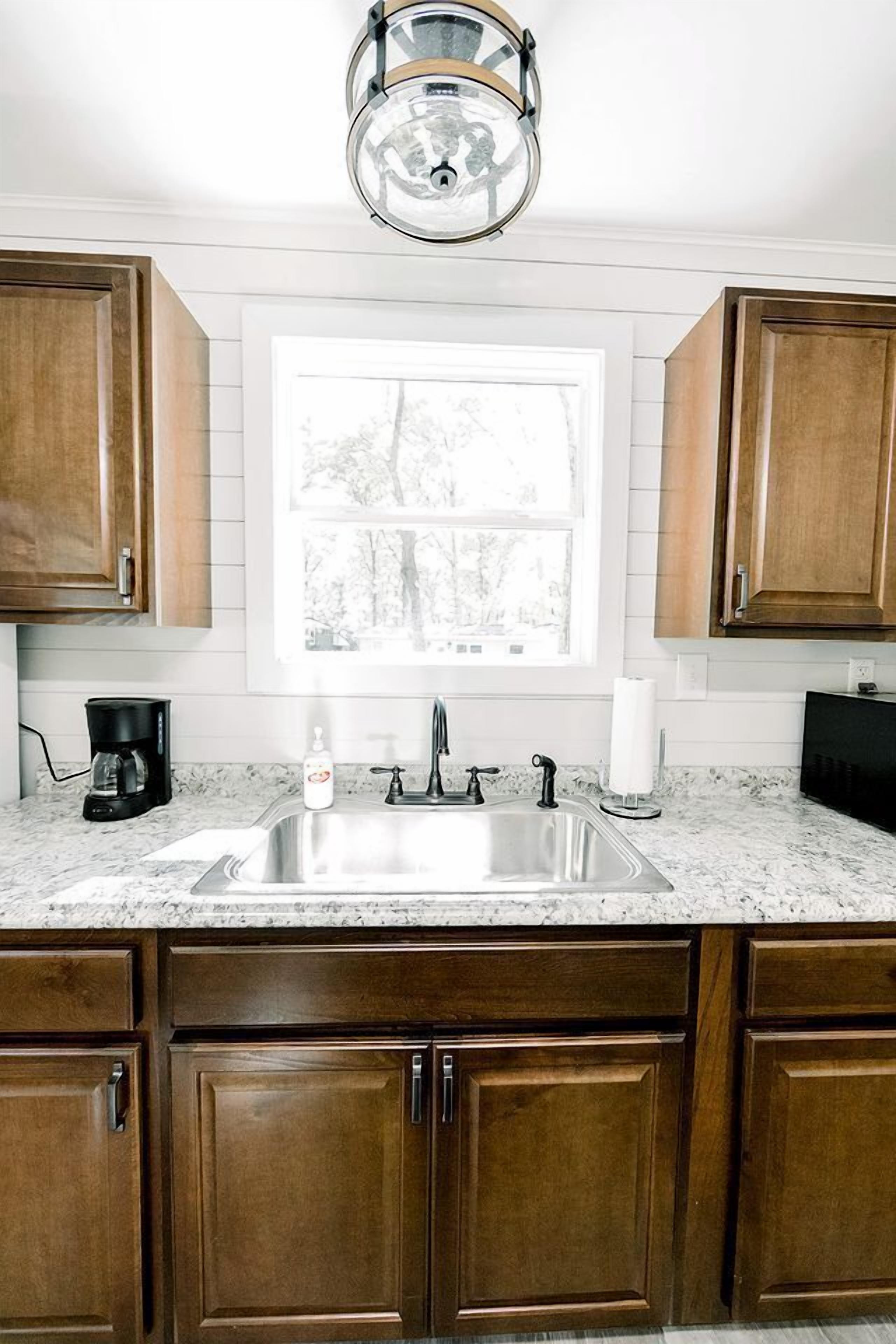 Coffee/tea maker, fridge, microwave, cookware/dishes/utensils