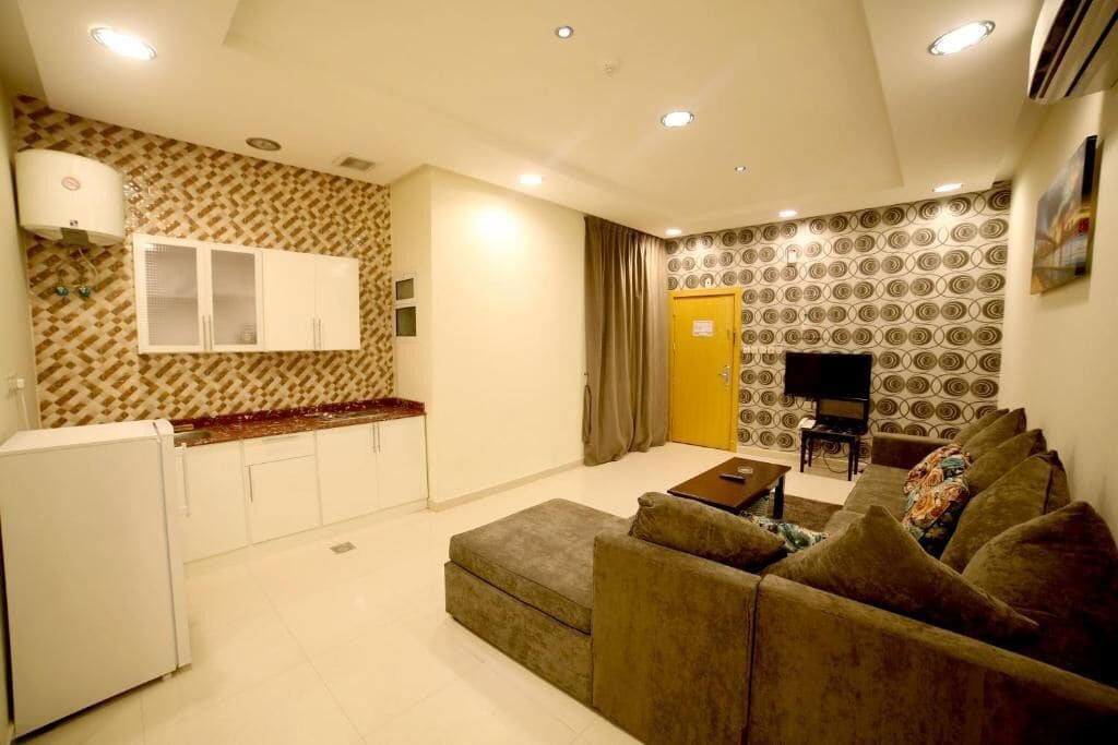 Deluxe Studio | Living area | 34-inch TV with satellite channels