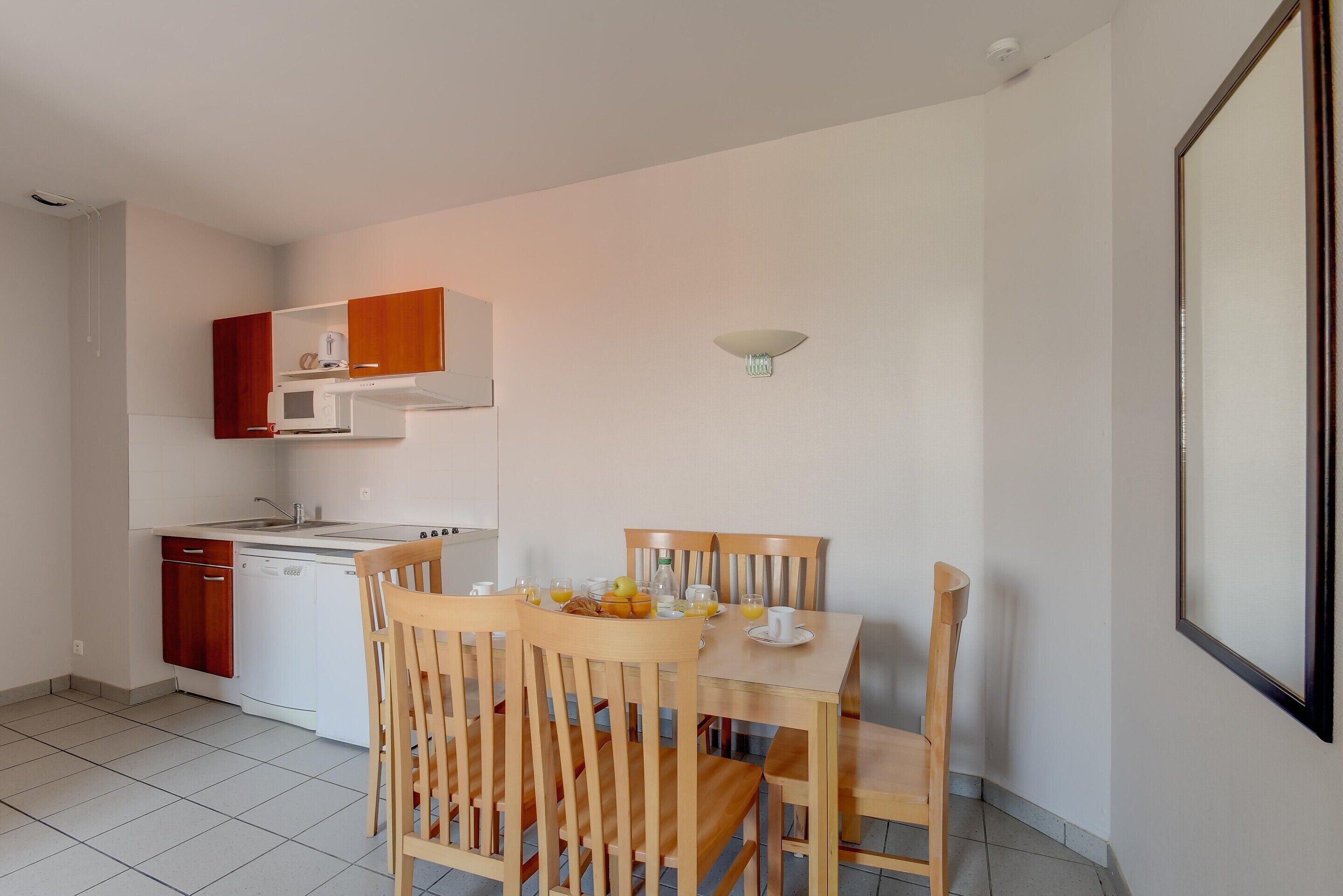 Apartment | Private kitchen | High chair, cleaning supplies