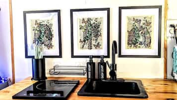 Coffee/tea maker, fridge, stovetop, cookware/dishes/utensils