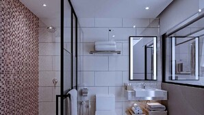 Un baño moderno con ducha, inodoro, lavabo y un espejo grande.