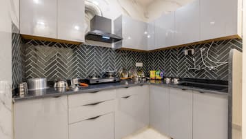 Fridge, coffee/tea maker, electric kettle, cookware/dishes/utensils