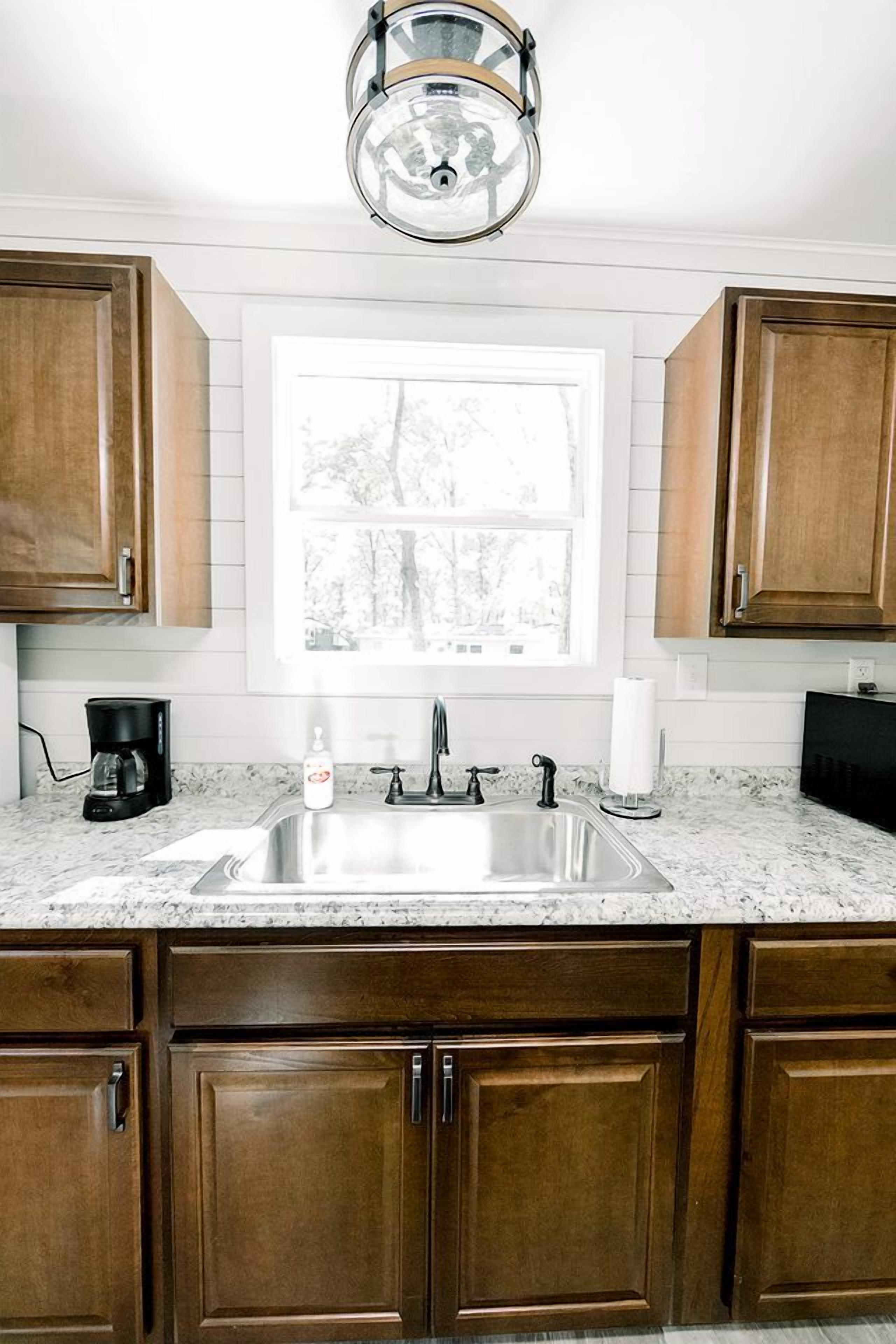 Coffee/tea maker, fridge, microwave, cookware/dishes/utensils