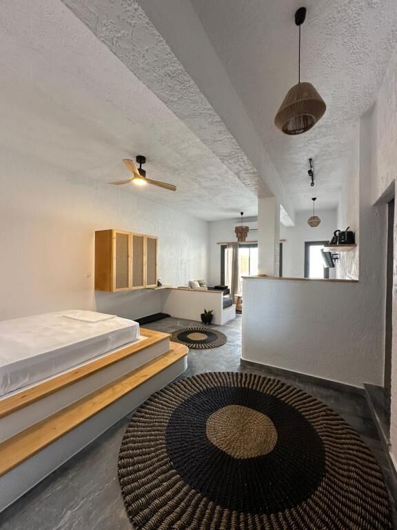 Deluxe Suite, Patio, Sea View | In-room safe, desk, laptop workspace, blackout curtains