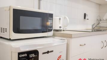 Microwave, electric kettle, toaster, cookware/dishes/utensils