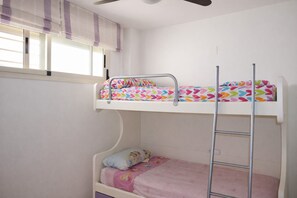 A bunk bed with a ladder, a window with blinds, and a ceiling fan. - Ap2110 in Denia With 2 Bedrooms and 1 Bathrooms (Denia)