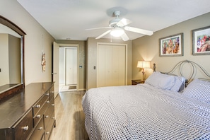 A bedroom with a bed, dresser, ceiling fan, and two framed pictures on the wall. - Lake & Dock Access! Waterfront Hot Springs Haven (Hot Springs)