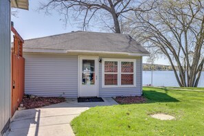 A small house with a front door, a window, and a mailbox. - Waterfront Cabin w/ Boat Slip & Views in Croton! (Newaygo)