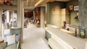 A modern interior with a reception desk, seating area, and a fireplace. - 6-person Apartment Near Ski Lifts (Vaujany)