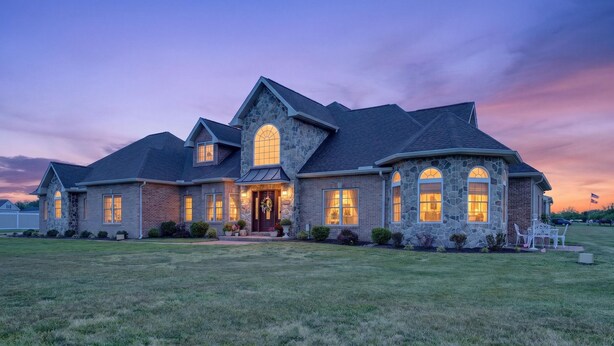 A large, two-story house with a stone facade, multiple windows, and a well-maintained lawn. - Milford Quiet Coastal Retreat 3br Sleeps 8 3 Bedroom Home (Milford)