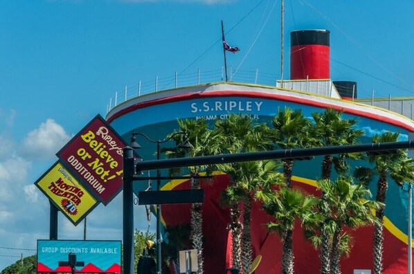 A large ship-shaped building with the name 'S.S. Ripley' and a sign for 'Ripley's Believe It or Not! Moving Theater.'